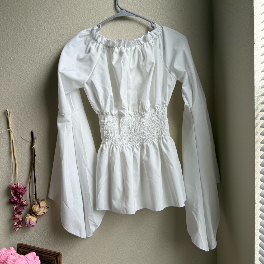 white “pirate” shirt